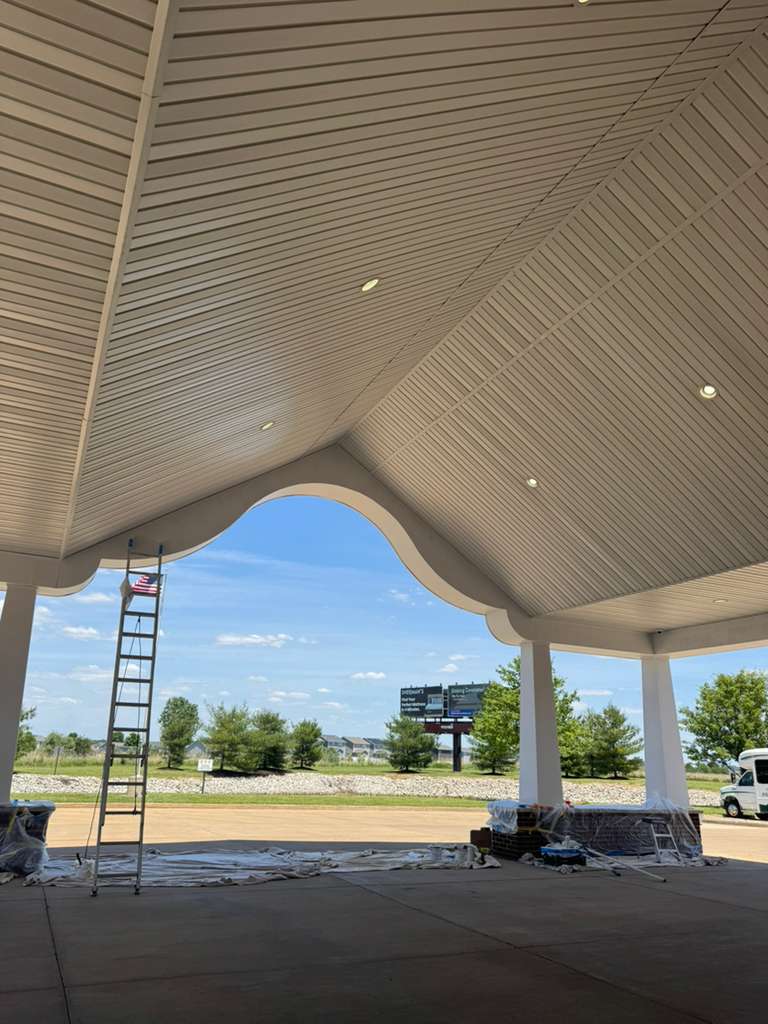 Commercial building canopy mid-repaint