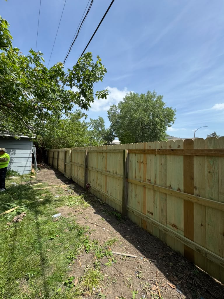 New wood privacy fence installed by Mechan LLC