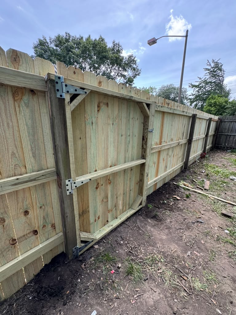 New fence gate with hardware installed