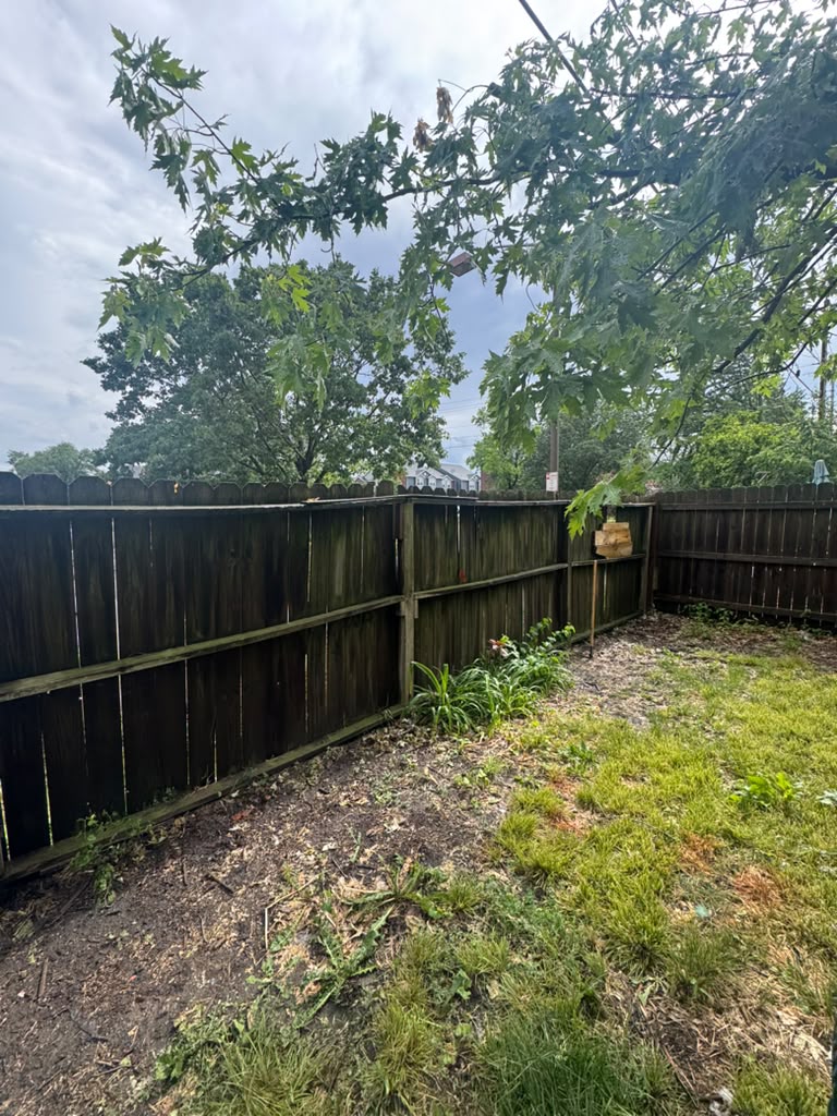Weathered fence corner before replacement