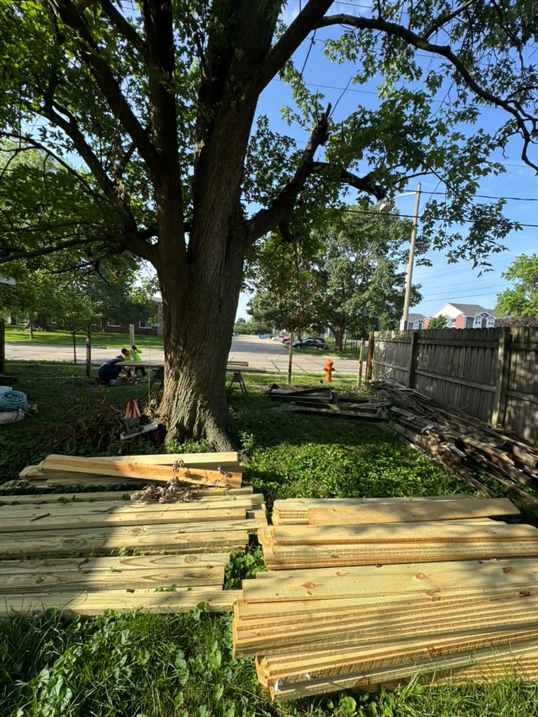 New wood fence installation in progress