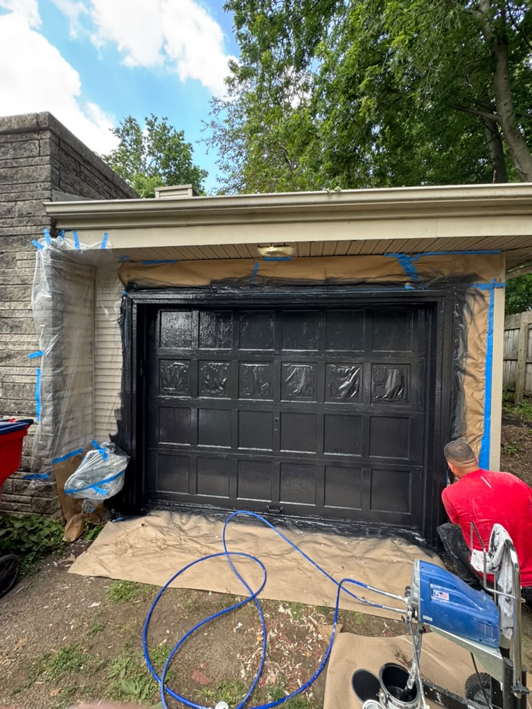 Garage exterior mid-project with equipment set up