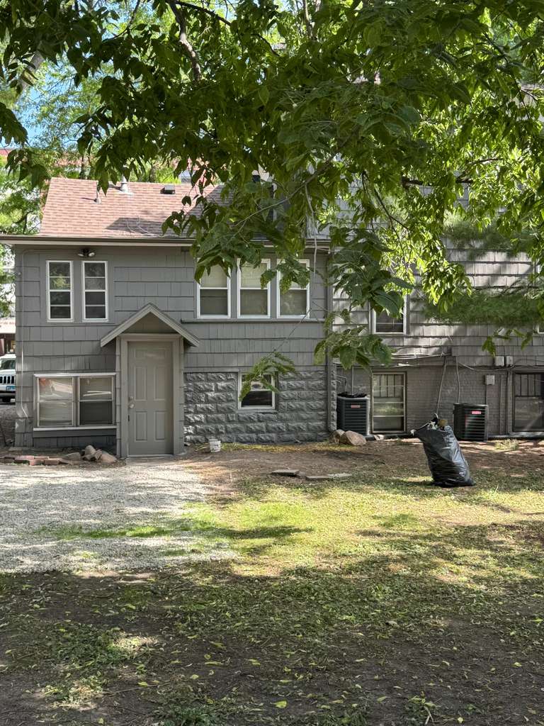 Finished home exterior surrounded by trees