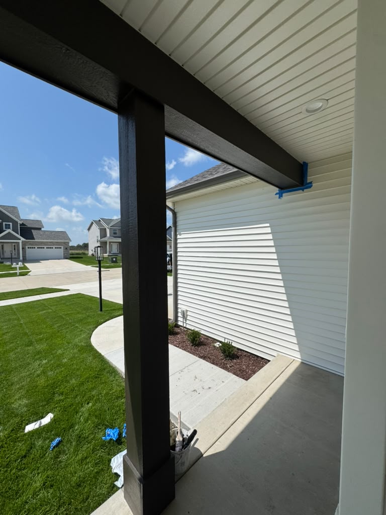 New construction porch ceiling being painted