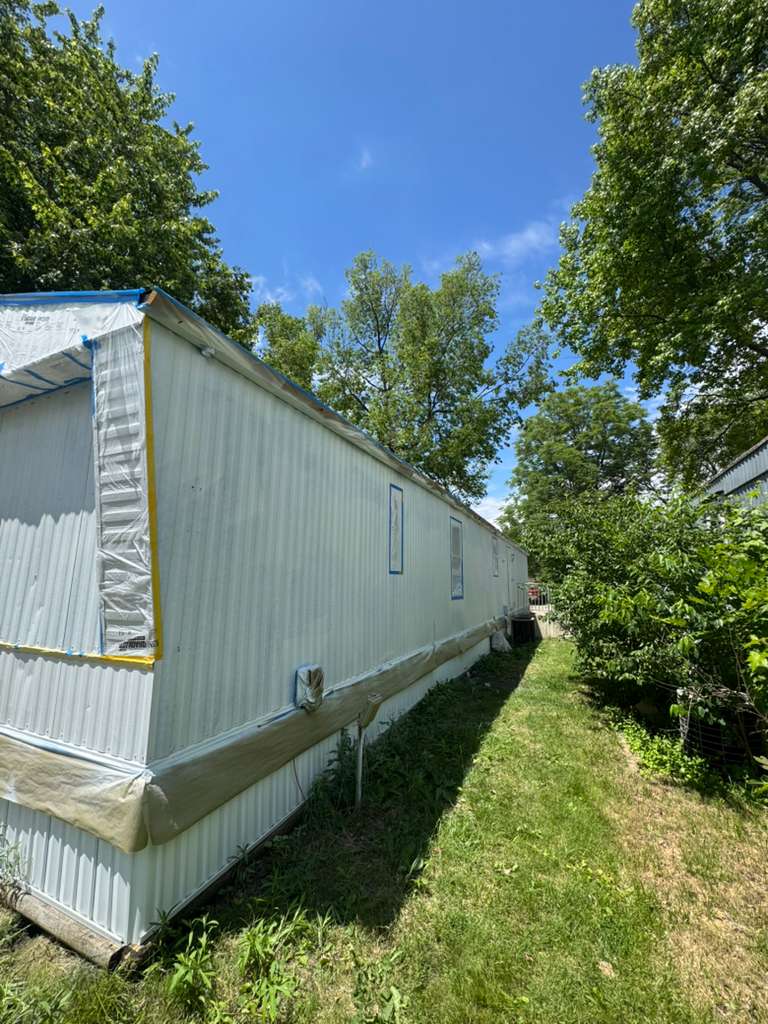 Mobile home exterior mid-project, another angle