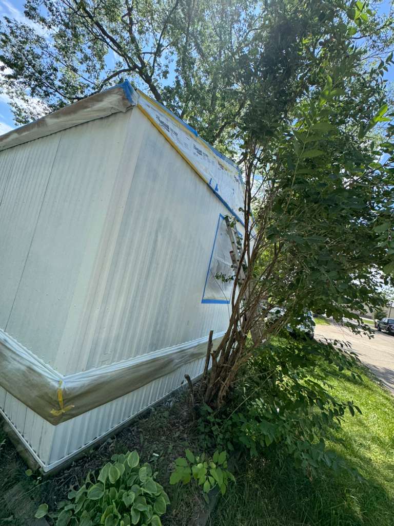 Mobile home exterior mid-project, wide view